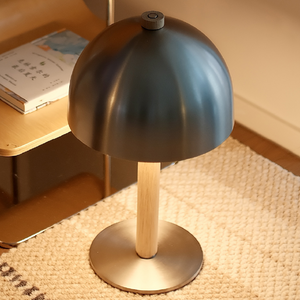 Table lamp with wooden base and metallic shade