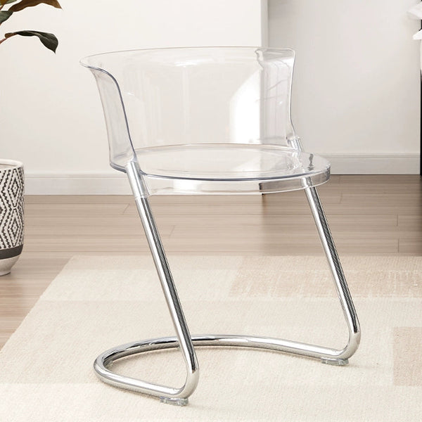 Clear chair with metal legs in a room setting