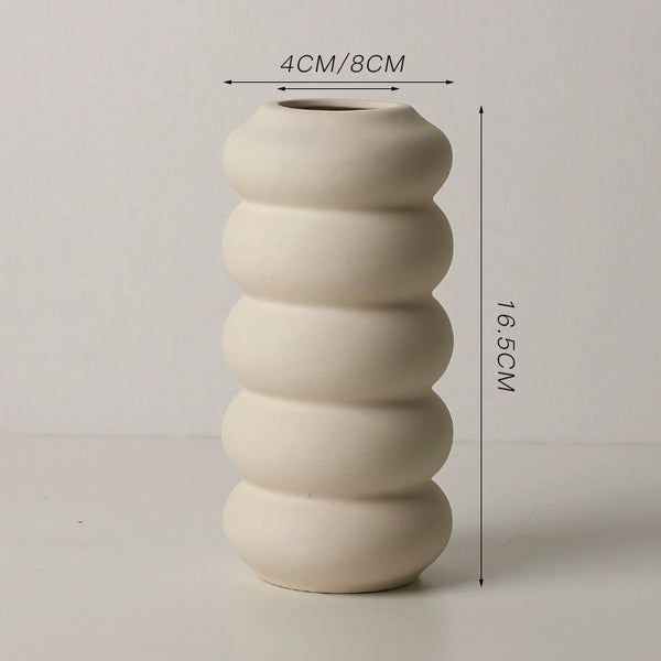 Beige ribbed vase with measurements on a light gray background