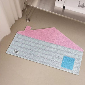 Multicolored rug on a floor with a Chanel book in the background